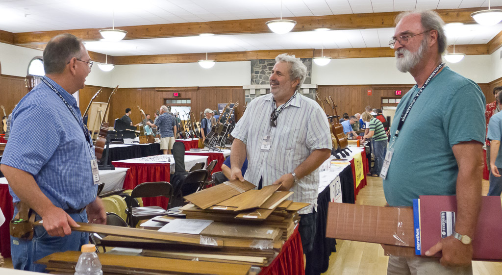 men discussing tonewood